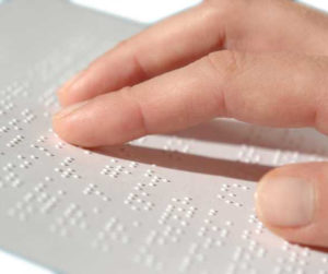 person reading Braille