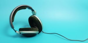 A photo of headphones on blue background