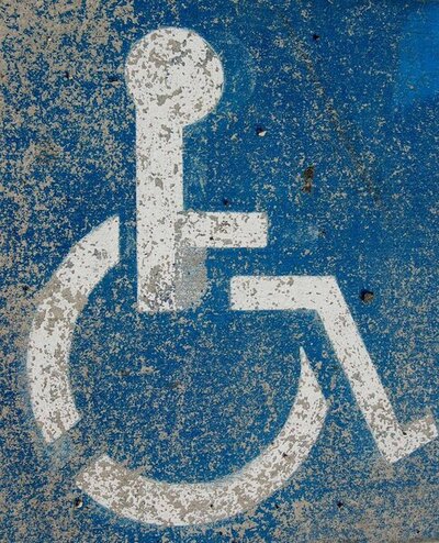 Wheelchair sign; white on blue background