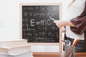 A blackboard covered in maths equations