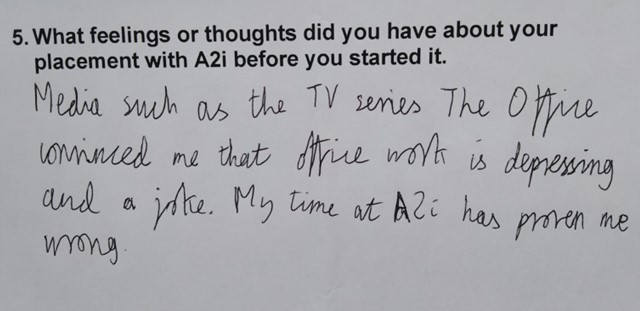 Handwritten answer by Oscar which says "Media such as the TV series The Office convinced me that office work is depressing and a joke. My time at A2i has proven me wrong.