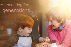 A photo of an older lady sitting at a table interacting with each other and smiling. Text in the photos says 'connecting for generations'