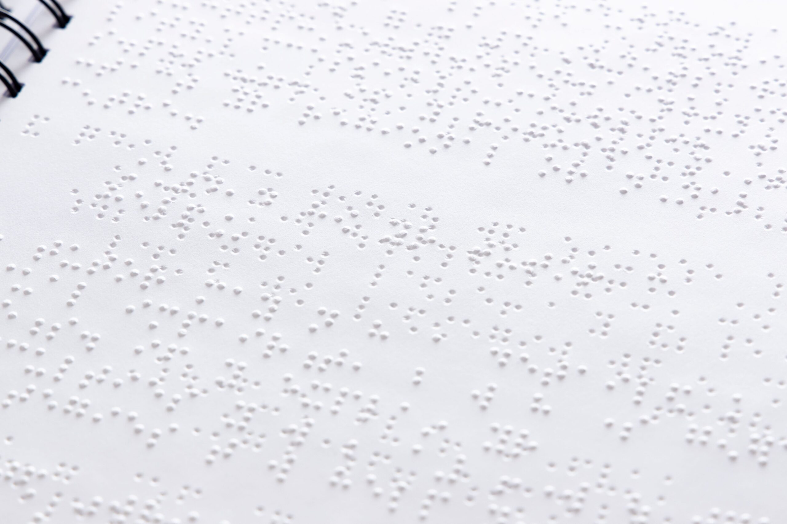 A photo of Braille on white paper