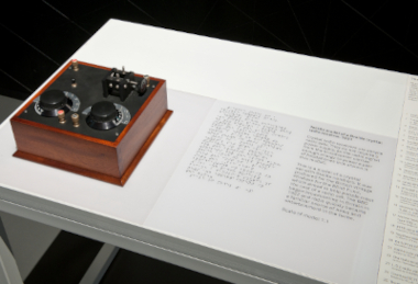 A tactile object in Information Age at the Science Museum, with a Braille and Large Print label.