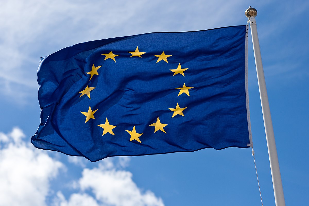 Flag of the European Union with a blue sky background