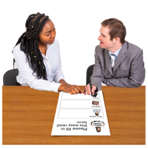 A woman is going through the content of an Easy Read document with a man with a learning disability